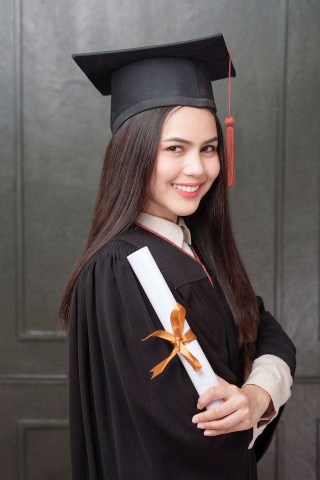 portrait of young woman in graduation gown